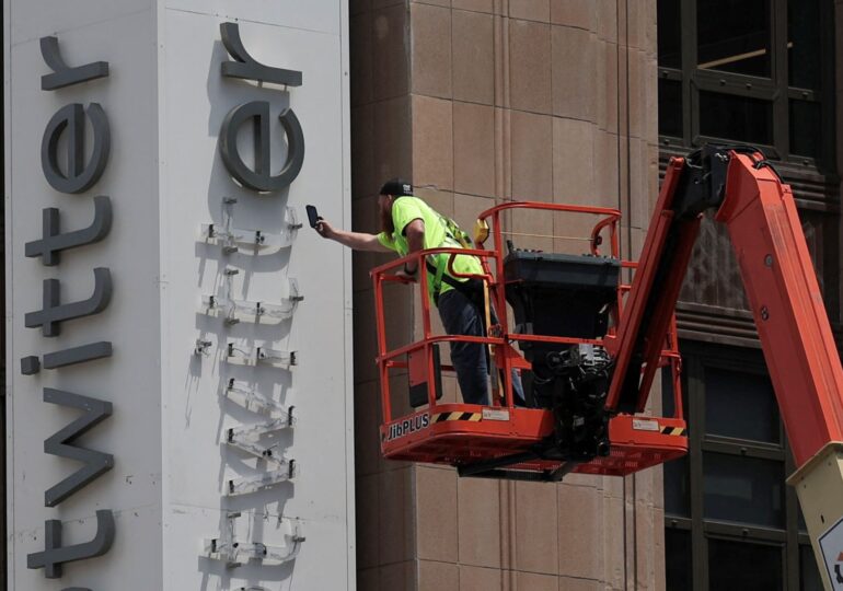 Elon Musk reveals why he's rebranding Twitter to X - as police disrupt company's sign removal